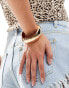 Accessorize large shiny bangle in gold