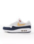 Nike Air Max 1 SC trainers in white, navy and gold