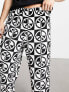 ASOS DESIGN pyjama set with t-shirt and trousers in black with fleece printed bottom
