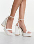 Glamorous platform heel sandals in white patent