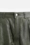 WRINKLED-EFFECT LEATHER TROUSERS