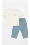 Фото #1 товара LCW baby Hakim Yaka Kısa Kollu Baskılı Erkek Bebek Tişört ve Pantolon 2'li Takım