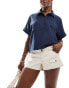 Фото #1 товара Hollister low rise cargo short in cream