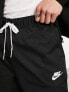 Nike – Club – Schmal zulaufende Hose aus Webstoff in Schwarz