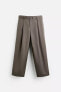 BELTED PLEATED TROUSERS