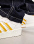 Фото #6 товара adidas Originals Rivalry Low trainers in white/gold