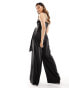 Flounce London – Seitlich gebundener Jumpsuit aus Satin in Schwarz mit Wasserfallausschnitt