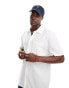 ASOS DESIGN relaxed polo shirt with front pocket in white