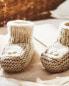 Knitted booties with floral detail