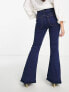 ASOS DESIGN Petite power stretch flared jeans in dark blue