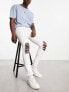 Фото #7 товара ASOS DESIGN spray on jeans with power stretch with heavy rips in white