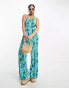 Monki jersey plisse cross back detail jumpsuit in blue and green flower print