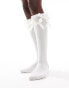 Reclaimed Vintage knee high socks with bows in white