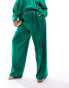 Фото #6 товара Flounce London Plus satin floaty trousers in emerald green co ord