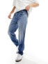 Lee Oscar relaxed tapered fit distressed jeans in mid vintage wash