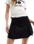 Obey cargo pocket mini skirt in black