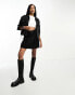 In The Style Tall exclusive box pleat denim mini skirt in black