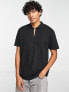Фото #1 товара ASOS DESIGN relaxed fit polo with clasp detail in black
