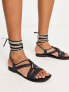 Фото #1 товара Free People leather wrap sandal in black and cream