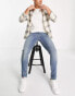 Фото #1 товара ASOS DESIGN skinny jeans in mid wash blue