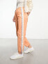 Фото #1 товара Aape By A Bathing Ape college parachute trousers in orange