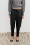 Faux leather jogging trousers