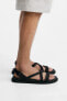 Sandals with criss-cross straps