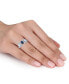 ფოტო #2 პროდუქტის Blue Topaz (1-3/5 ct.t.w.) and Diamond (1/5 ct.t.w.) 3-Stone Halo Ring in Sterling Silver