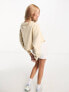 Фото #2 товара Calvin Klein Jeans cropped crew neck seaming sweatshirt in beige - exclusive to ASOS