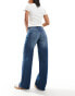 Weekday Ample low waist baggy fit jeans in streaky blue wash