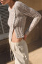 Asymmetric open-knit sweater