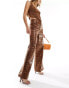 Фото #2 товара ASOS DESIGN leather look wide leg trousers in animal