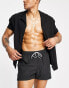 Фото #3 товара ASOS DESIGN swim shorts in short length in black