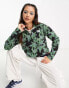 Фото #1 товара The North Face Glacier 1/4 zip cropped fleece in green flower print Exclusive at ASOS