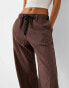 Bershka ribbon drawstring waist wide leg trousers in brown & stripe