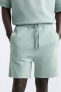 Compact jogger bermuda shorts