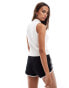 Tommy Jeans flag sleeveless knitted top in white