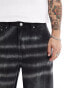 ASOS DESIGN loose fit jeans in black with extreme wash