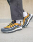 Nike Air Max 97 trainers in black and university gold