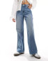 Фото #5 товара Hollister ultra high rise baggy fit jeans in mid blue