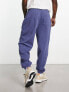 ASOS DESIGN oversized joggers in navy with collegiate multiplacement print