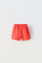 Plush bermuda shorts with label detail