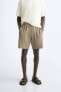 Textured mesh bermuda shorts