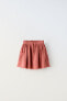 Textured skirt with mesh pockets