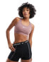 Фото #1 товара Nike Training Swoosh Dri-Fit medium support bra in smokey mauve