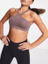 Nike One Training Indy novelty dri fit lace back light support sports bra in plum