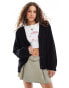 Фото #1 товара Monki cable knit boxy button front cardigan in black