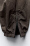 Фото #10 товара Нейлоновые брюки с молниями ZARA