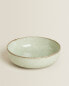 Porcelain bowl with antique finish rim