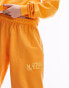 Фото #12 товара Topshop co-ord nyc project puff printed vintage wash oversized jogger in orange